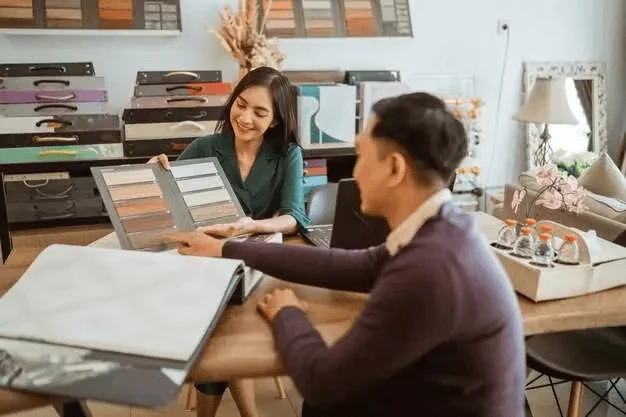 Aticus design consultation — customer selecting window treatment materials